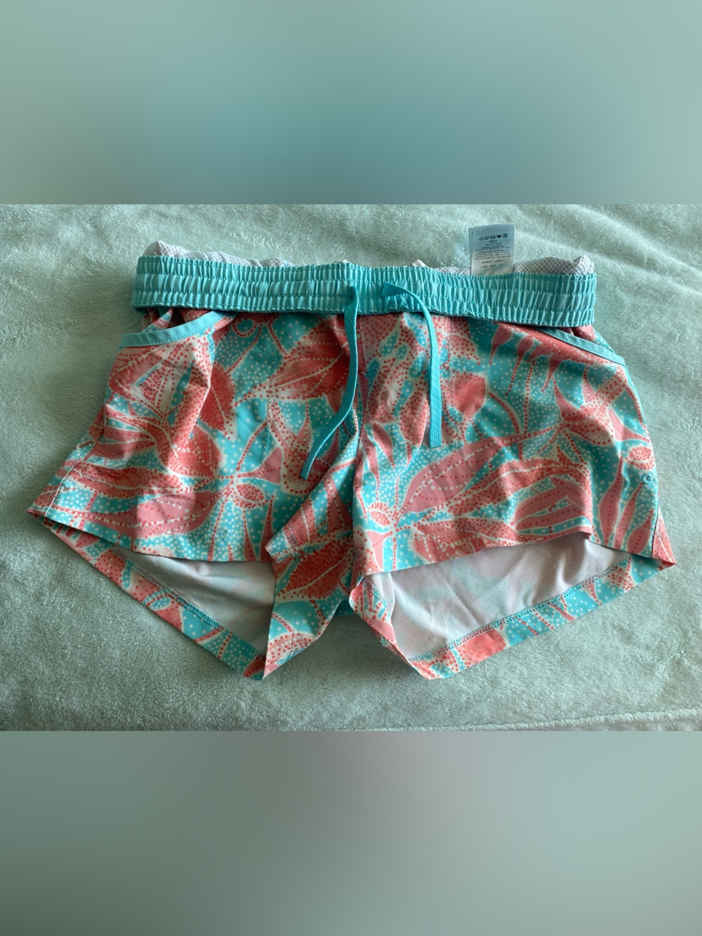 Columbia Women’s Athletic Shorts in Teal and Coral Leaf Print